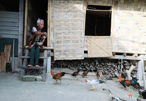 A person sitting on a porch next to a group of chickens

AI-generated content may be incorrect.